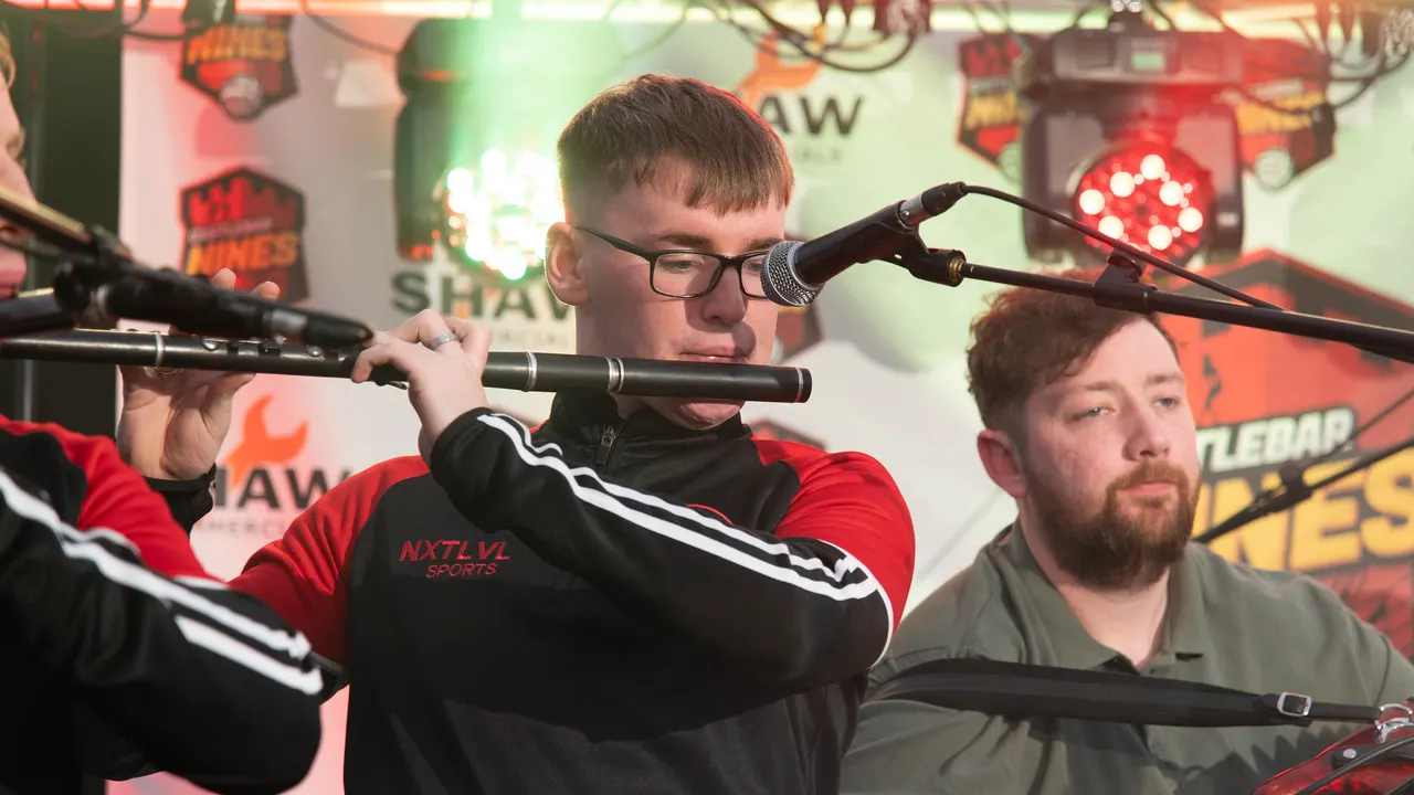 Flute player performing on the festival stage