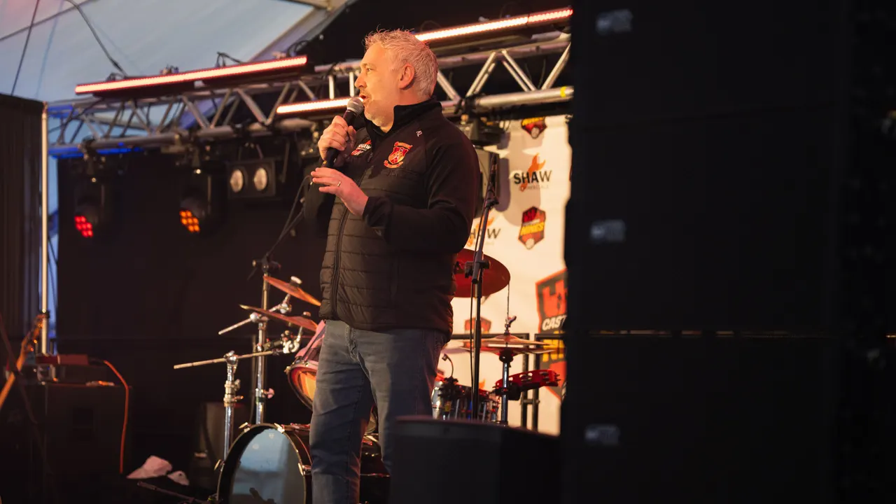 The MC introducing the comedy night on the marquee stage